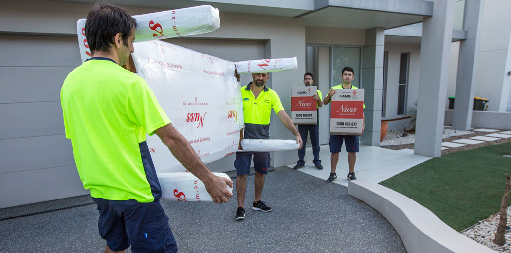 removalists in Sydney moving a large table and boxes