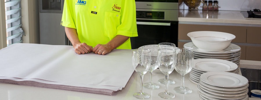 Removalist wrapping kitchen ware with packaging materials