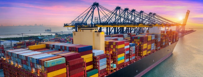 Aerial view of cargo ship and cargo container in harbour